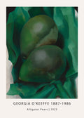 Close-up print of Georgia O'Keeffe's "Alligator Pears" (1923), showing two dark green avocado fruits nested in deep emerald green folds and shadows.