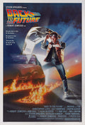 Back to the Future movie poster showing Marty McFly standing in front of the flaming DeLorean time machine ready for time travel.