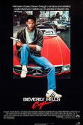 Classic 1984 Beverly Hills Cop movie poster showing Eddie Murphy (Axel Foley) sitting on a red Mercedes, holding a gun, against an L.A. street background.