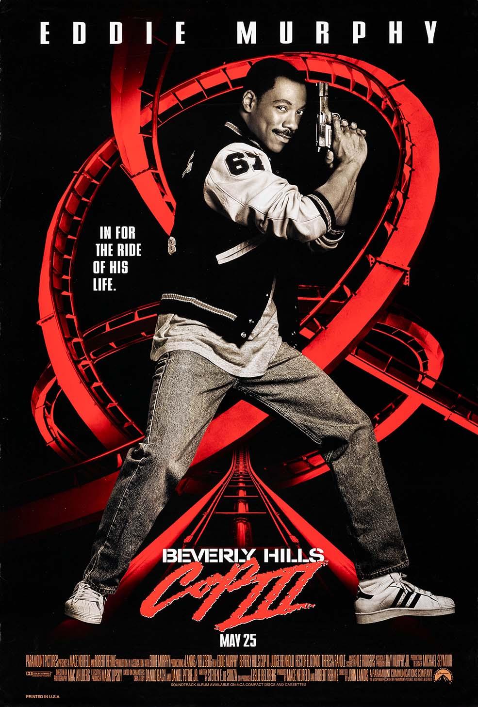 Official Beverly Hills Cop III movie poster showing Eddie Murphy as Axel Foley holding a gun against a vivid red roller coaster backdrop.