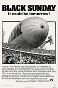 Original Black Sunday movie poster featuring a colossal, dark blimp looming dramatically over a large, panicked crowd in a Super Bowl stadium.