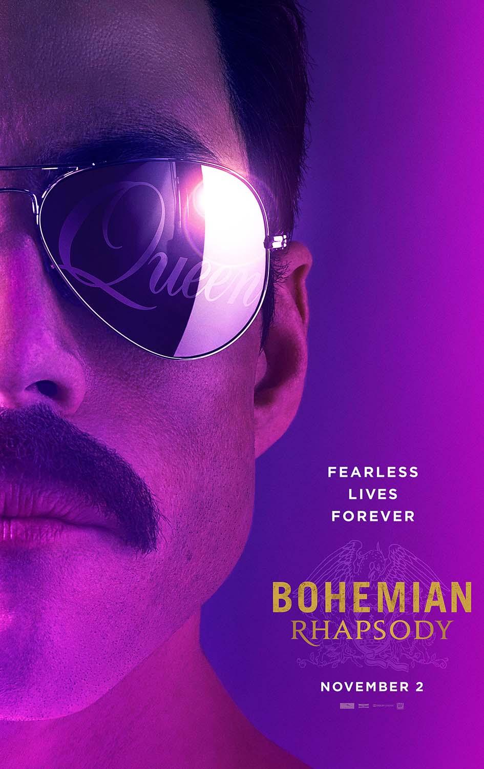 Close-up shot of Freddie Mercury (Rami Malek) wearing aviator sunglasses reflecting the Queen logo, from the Bohemian Rhapsody 2018 movie poster.