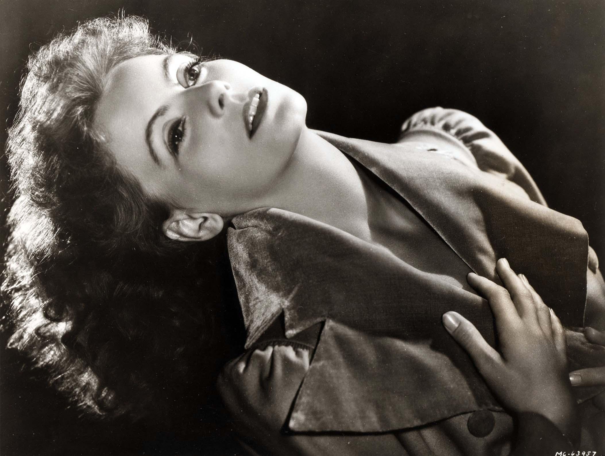 Black and white close-up photo print of actress Greta Garbo, angled dramatically, featuring soft studio lighting and a velvet collar from the film Conquest.