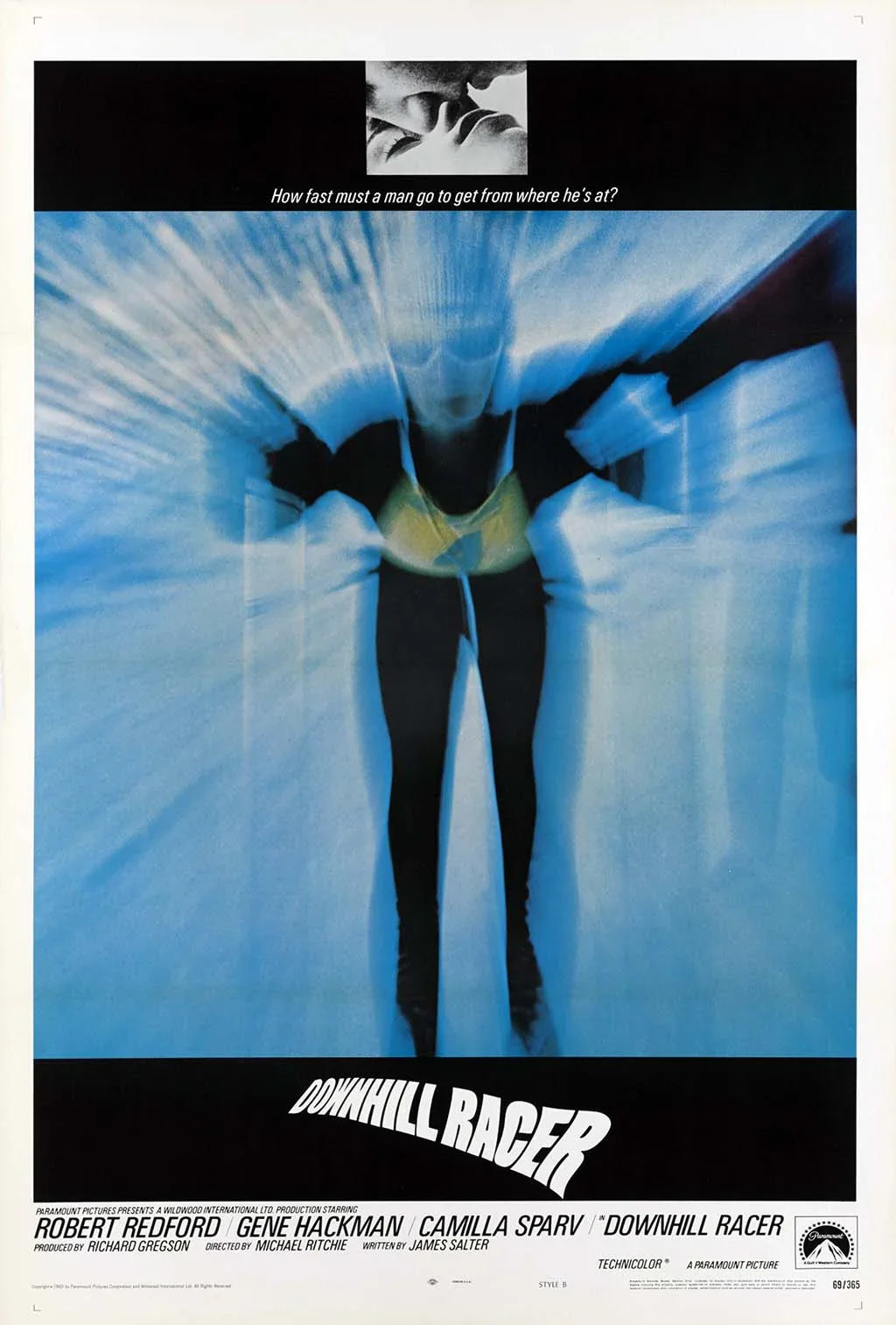 Vintage Downhill Racer movie poster featuring an abstract, blurred image of a skier in black and blue motion streaks with the tagline.