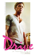 Drive 2011 movie poster showing a close-up of Ryan Gosling in a distressed white shirt, featuring the vibrant pink script title logo.