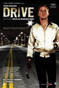 Official theatrical release poster for the 2011 movie Drive showing Ryan Gosling in the iconic scorpion jacket standing on a dark, wet city street.