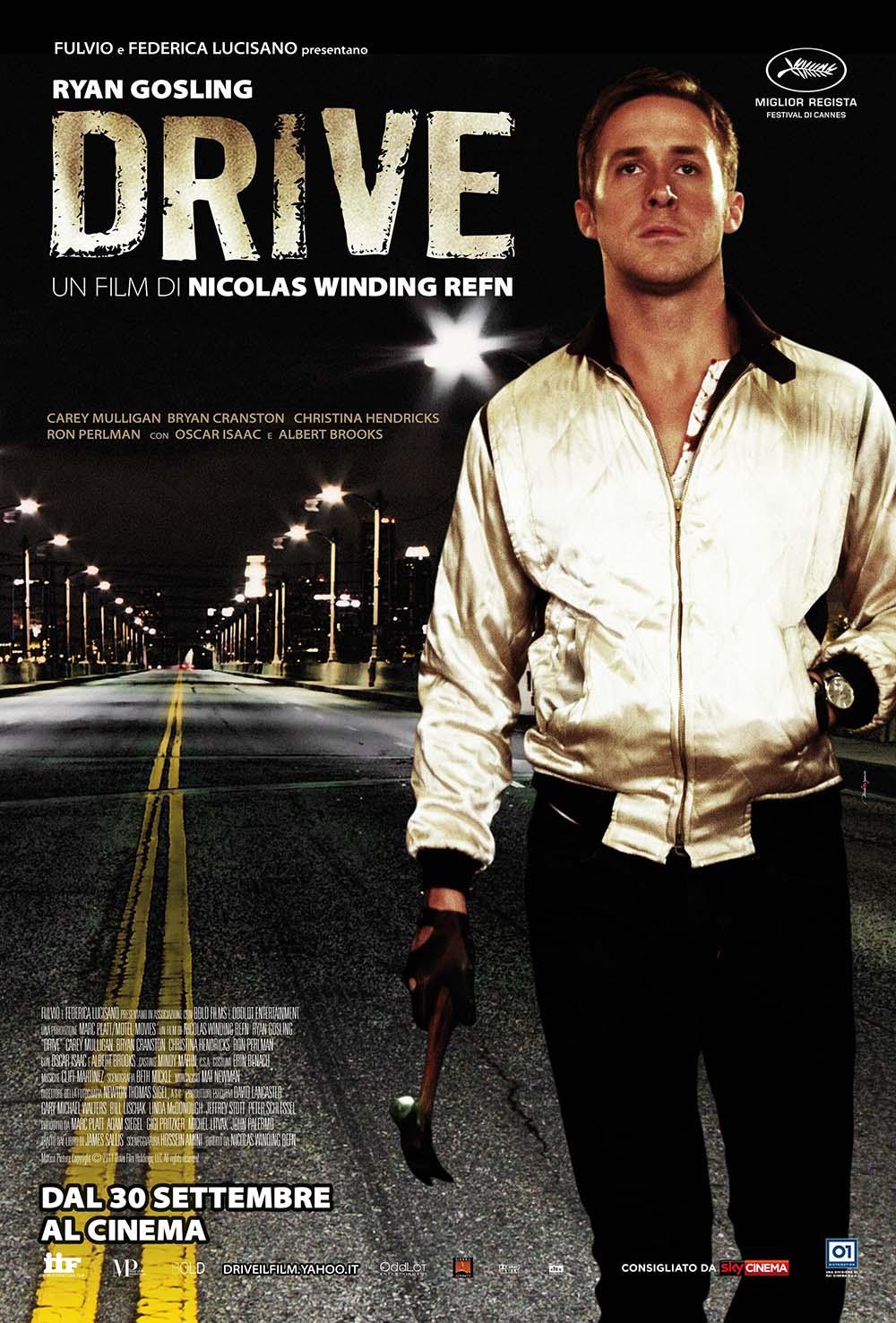 Official theatrical release poster for the 2011 movie Drive showing Ryan Gosling in the iconic scorpion jacket standing on a dark, wet city street.