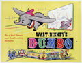 Iconic 1941 Dumbo movie poster showing the flying elephant and Timothy Q. Mouse soaring over the circus train on a bright yellow background.