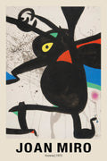Abstract art print by Joan Miró titled "Femme" (1973), showing a thick black figure with yellow and red geometric accents on a splattered white background.