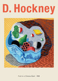 David Hockney 1988 still life painting of abstracted fruit overflowing from a detailed blue Chinese bowl, set against textured yellow and red backgrounds.