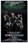 Original theatrical poster for Ghostbusters 1984 showing Bill Murray, Dan Aykroyd, and Harold Ramis posing heroically in their grey ghost-busting uniforms, armed with proton packs.