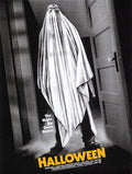 Halloween movie poster with ghost in sheet and glasses standing in doorway, tagline The Night He Came Home