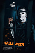 Michael Myers in white mask holding large knife behind a glass door with fallen leaves Halloween poster