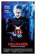 Original theatrical poster for Hellraiser (1987) featuring Pinhead holding the glowing Lament Configuration puzzle box against a dark blue background.