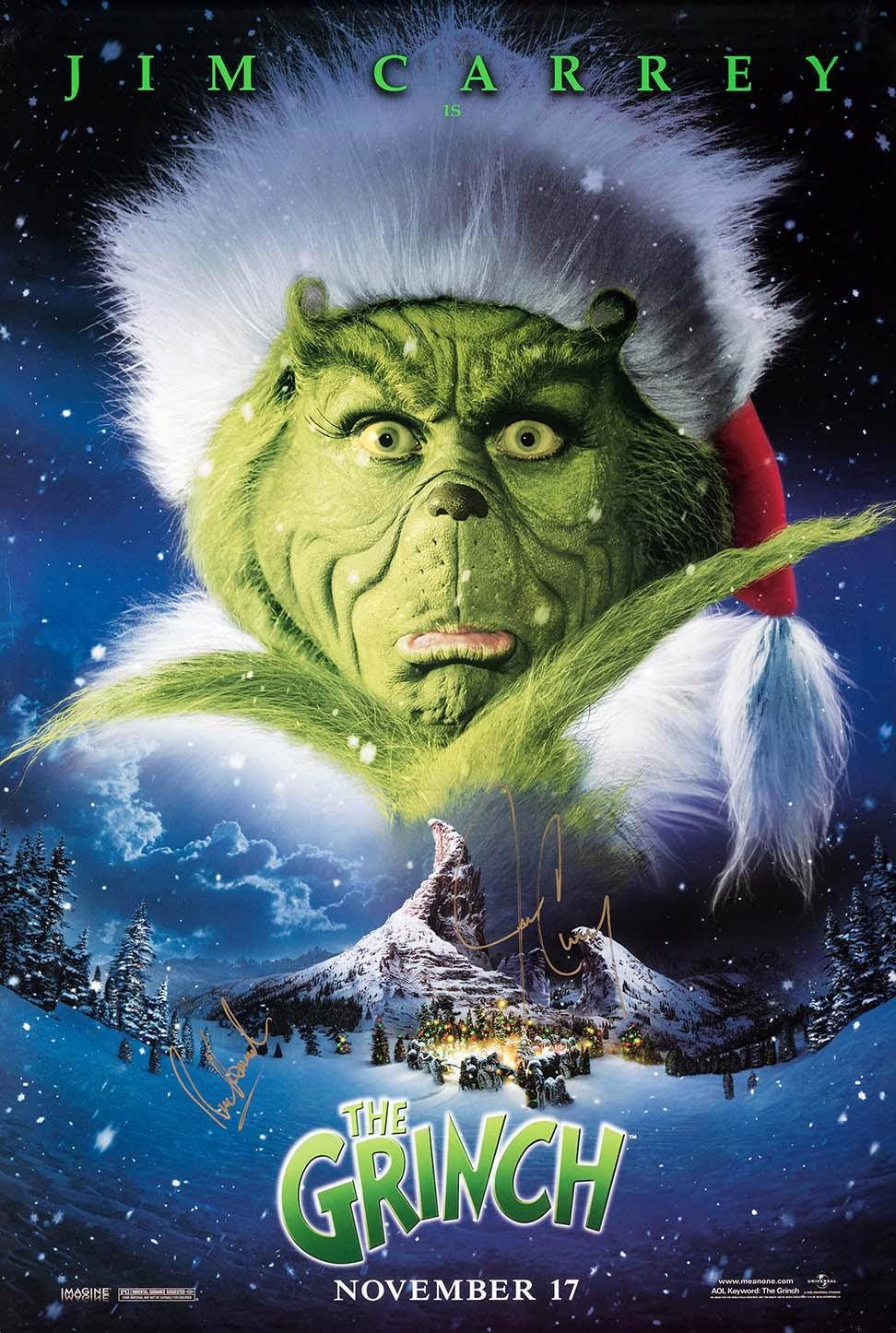 Advance movie poster showing the Jim Carrey Grinch peering down maniacally over a snow-covered Whoville village and Mount Crumpit.