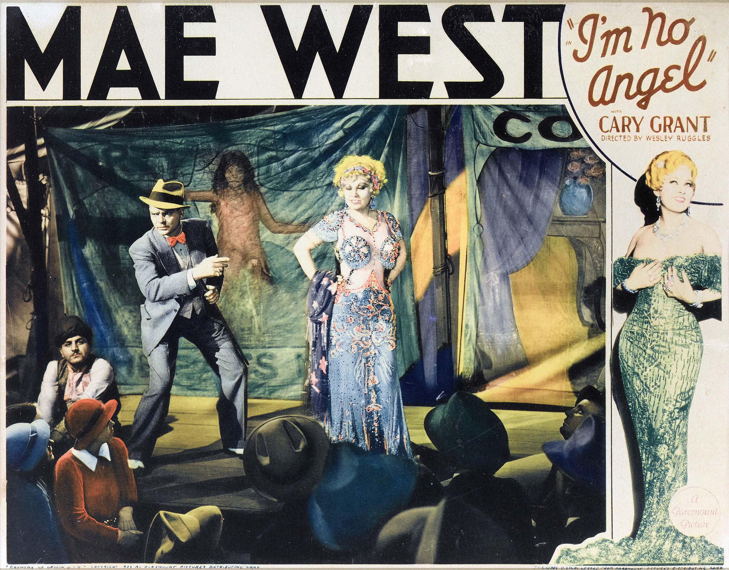 Vintage movie lobby card for the 1933 film "I'm No Angel" featuring Mae West in a stage dress and Cary Grant addressing an audience in a circus tent setting.