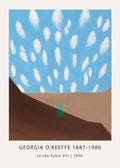 Georgia O'Keeffe painting, "In the Patio VIII," showing a vibrant blue sky with scattered white clouds above geometric brown and tan patio walls.