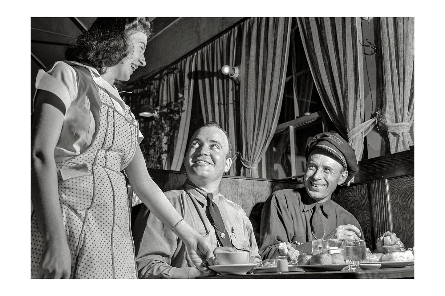Candid 1940s Diner Photo Wall Art: Waitress Talking to Patrons Poster