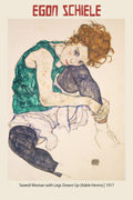 Egon Schiele drawing of Adele Herms, a seated woman with knees drawn up, wearing a green top and dark stockings, executed in 1917.
