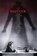 The Babadook movie poster with a mother and child in bathtub and ominous shadow on tiled wall