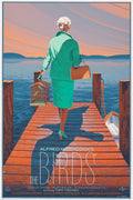 Vintage movie poster of Alfred Hitchcock's The Birds showing a woman in green walking on a wooden dock at sunset