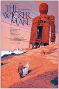 The Wicker Man movie poster featuring a towering wicker man structure on a hill with a couple in period clothing near the shore
