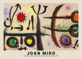 Abstract painting by Joan Miro (1954) showing bold black strokes, large red and yellow circles, and colorful dots on textured canvas.