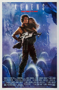 Original theatrical poster for James Cameron's Aliens showing Ellen Ripley holding Newt and carrying a large pulse rifle in a dark, atmospheric blue setting.