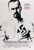 Black and white movie poster for American History X showing Edward Norton as Derek Vinyard covering his chest tattoo.