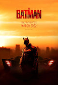 Official promotional poster for The Batman (2022) showing Robert Pattinson's character standing in front of his car against a vivid orange sunset backdrop.