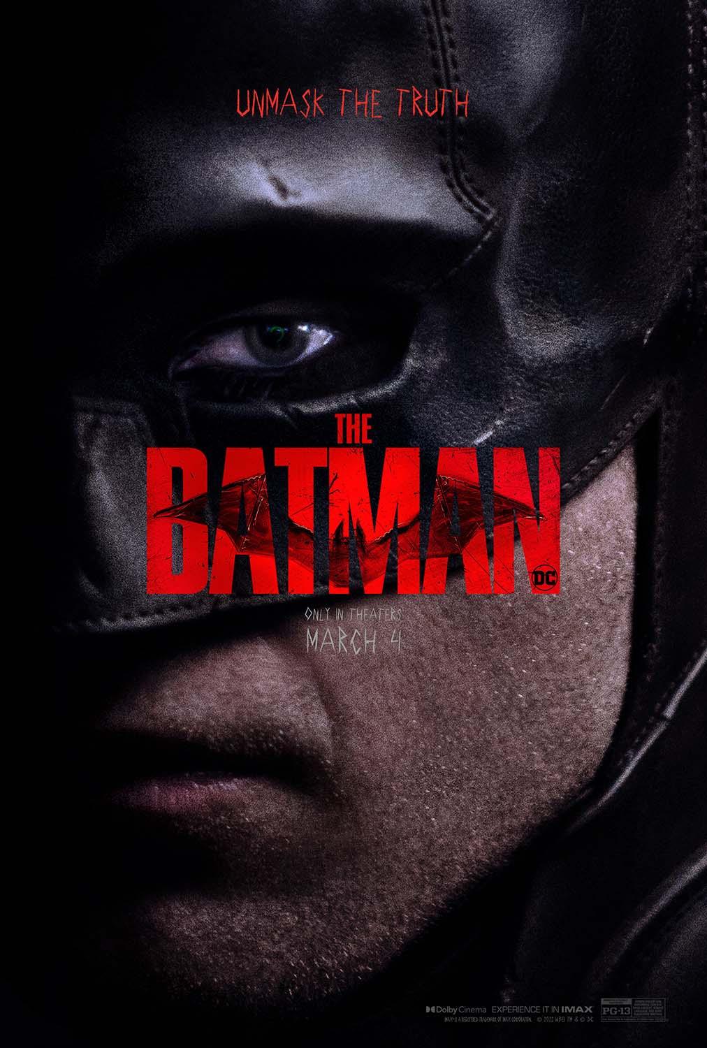 Close-up promotional poster for The Batman (2022) featuring Robert Pattinson's face and cowl in deep shadow with the red logo.