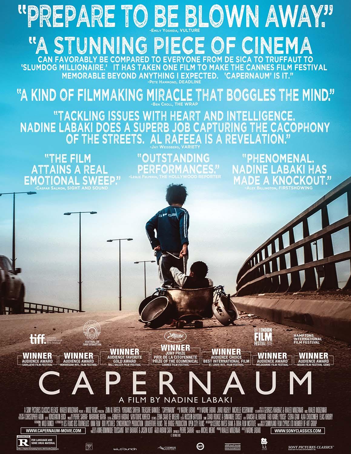 Official Capernaum movie poster showing the young protagonist running across an urban bridge pulling a container with various pans and vessels.