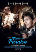 Iconic Cinema Paradiso movie poster showing young Salvatore smiling while holding a strip of vintage film reel.