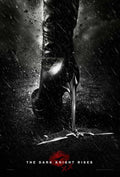 Dark Knight Rises movie poster showing a black leather boot (Catwoman) crushing a Batarang in the rain, featuring dramatic black and white lighting.