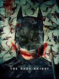 Official promotional poster for The Dark Knight showing a dark collage of Batman's face obscured by Joker cards and propaganda quotes.