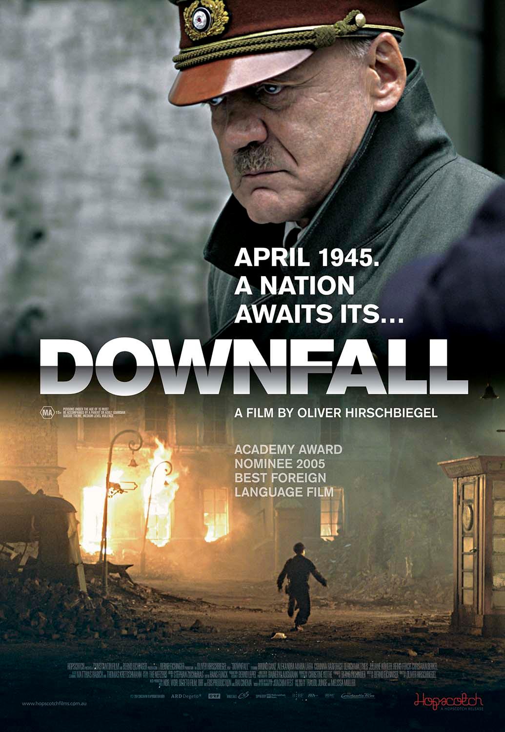 Downfall movie poster featuring a brooding close-up of Bruno Ganz as Hitler in uniform above a dark, fiery wartime street scene in Berlin.