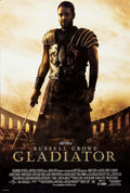 Official Gladiator movie poster showing Russell Crowe as Maximus in full Roman armor holding a sword in the Colosseum arena.