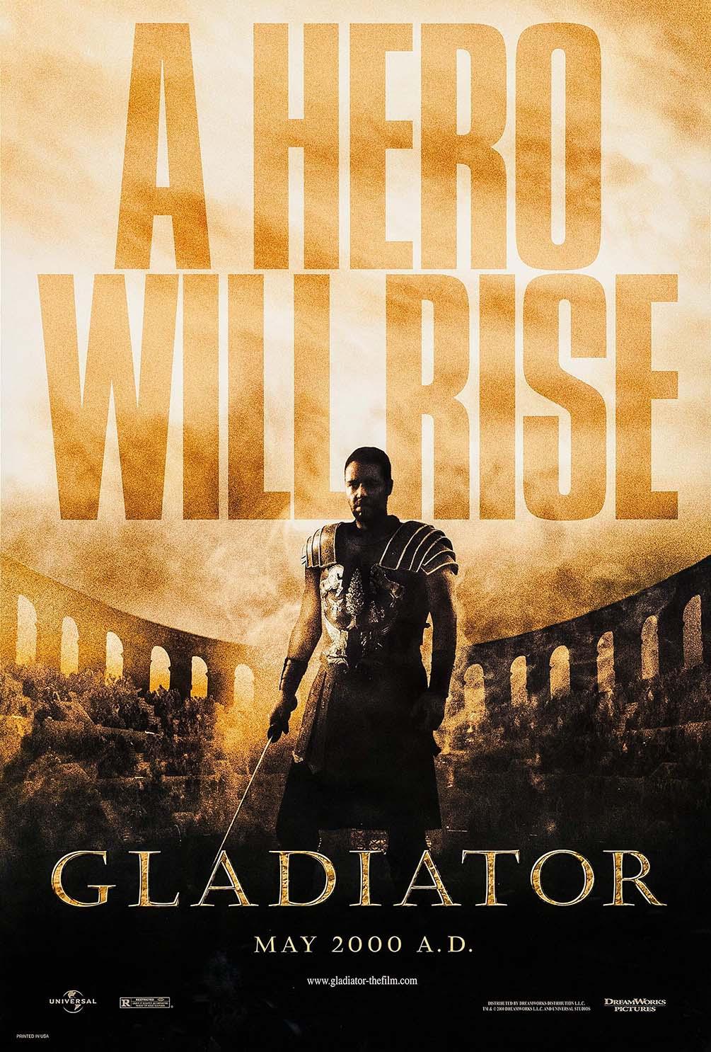 Official Gladiator movie poster featuring Maximus (Russell Crowe) standing in armor in the sun-drenched arena ruins beneath the tagline "A Hero Will Rise".