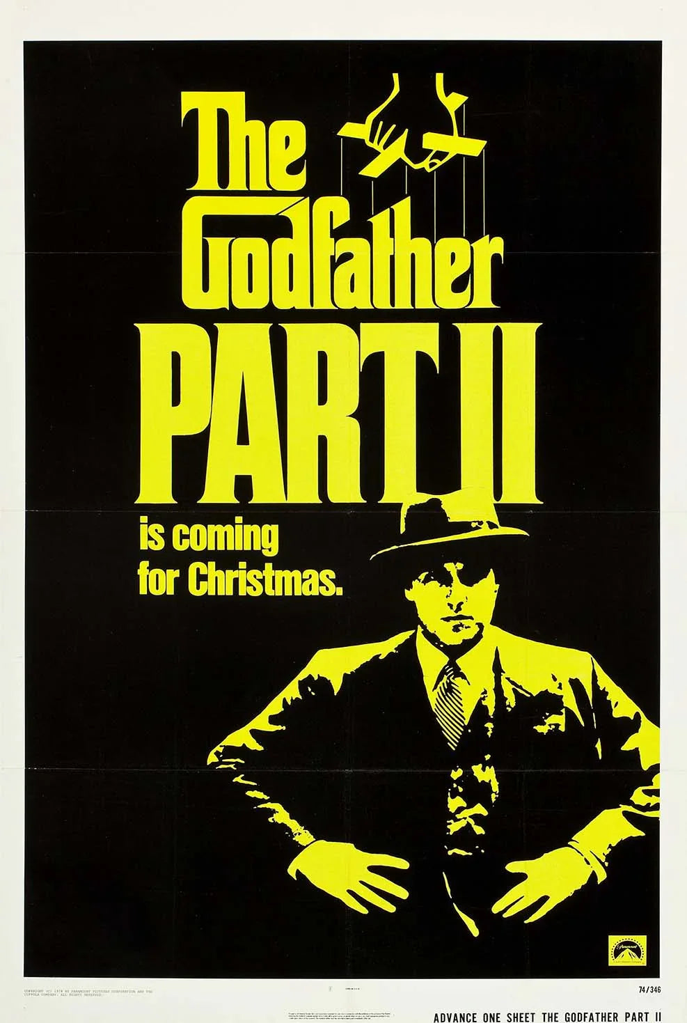 Official black and yellow movie poster for The Godfather Part II showing a stylized Michael Corleone silhouette and puppet strings above the title.