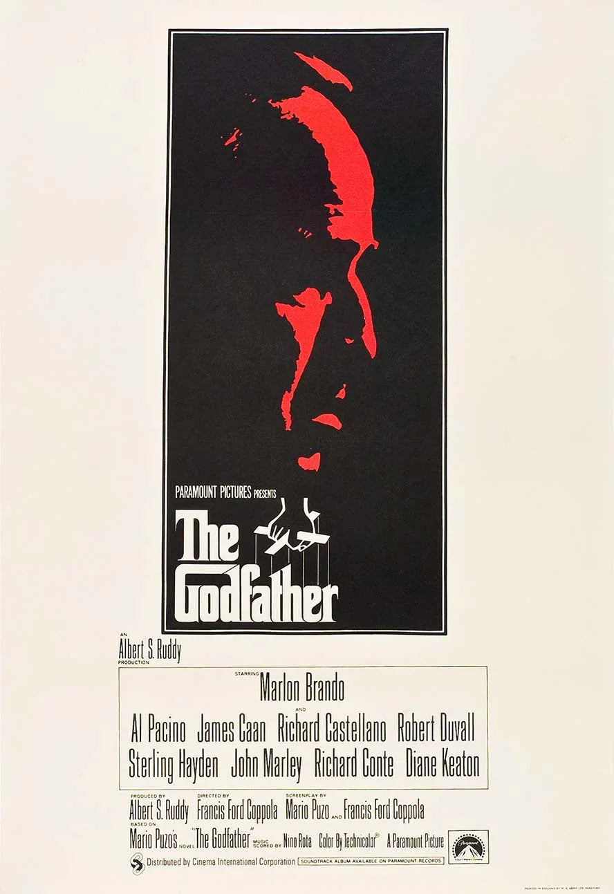 The Godfather movie poster featuring a stark red silhouette of Don Vito Corleone against a black background with white border and credits.