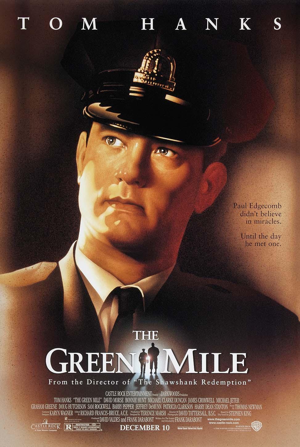 Original movie poster for The Green Mile showing Tom Hanks as Paul Edgecomb in his prison guard uniform under dramatic lighting.