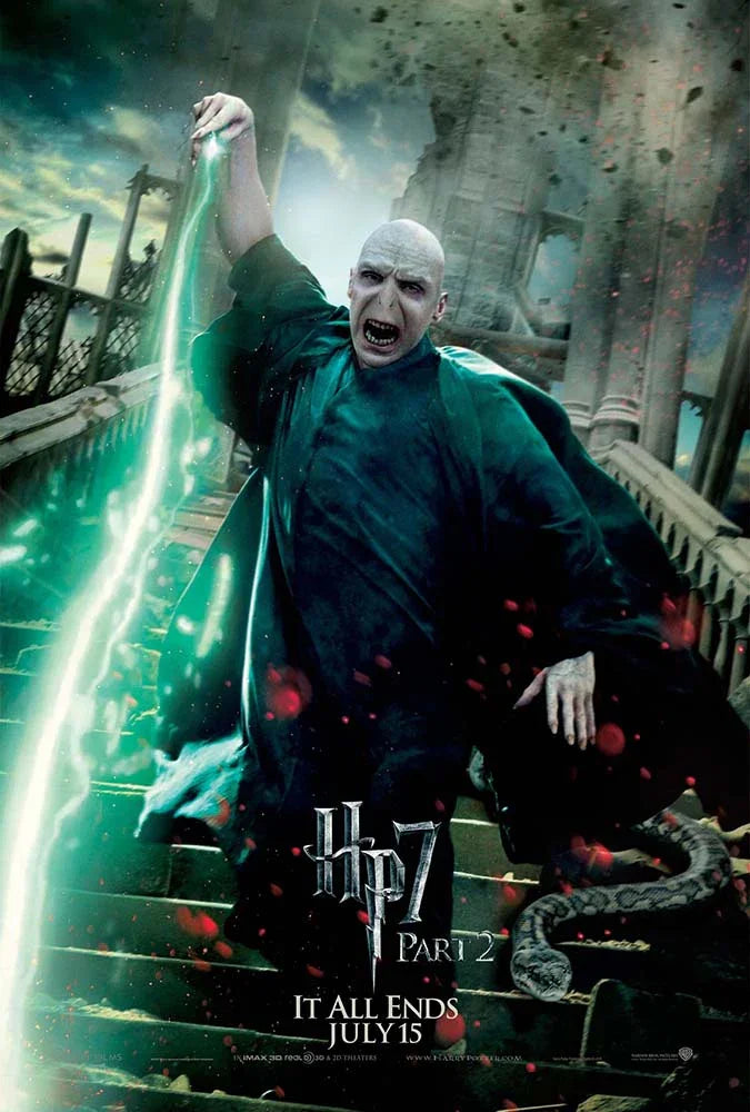 Official movie poster featuring Lord Voldemort casting a green curse (Avada Kedavra) during the Battle of Hogwarts, with Nagini on the steps.